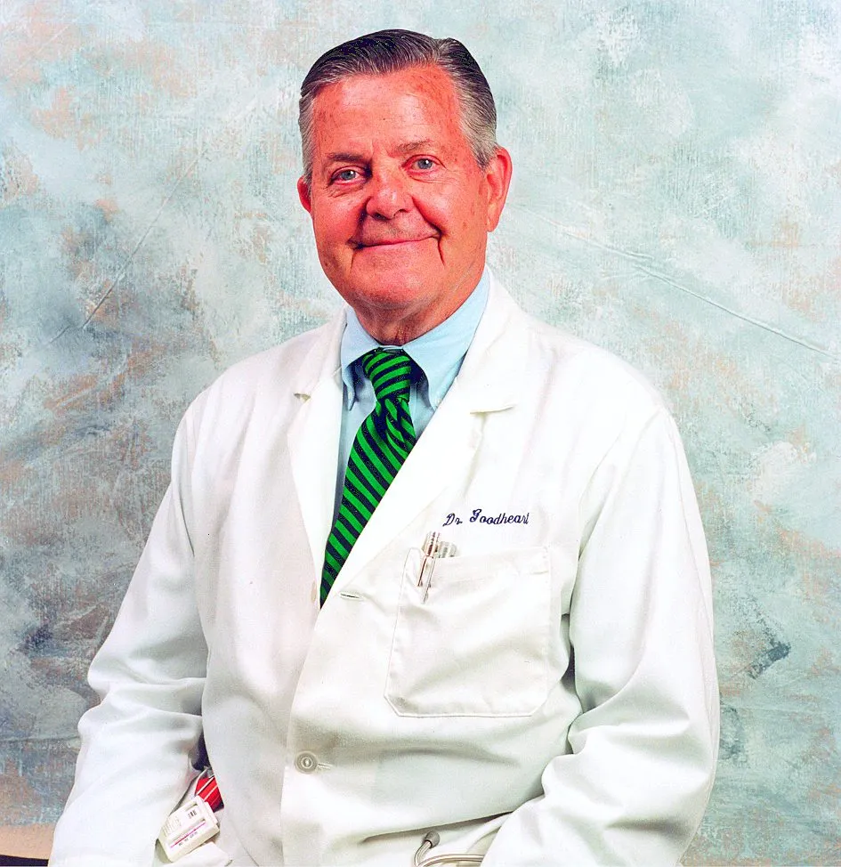 Dr George Goodheart, DC, the founder of Applied Kinesiology, photographed in a white clinic coat